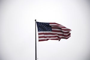 Image of the US flag blowing in the wind